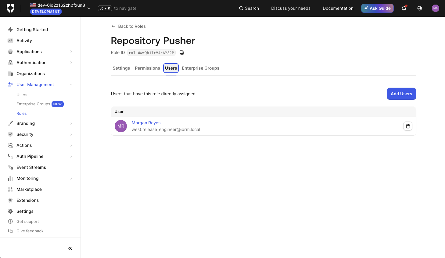 Auth0 console, Repository Pusher role, Users tab: Morgan Reyes, west.release_engineer@idrm.local, listed as directly assigned